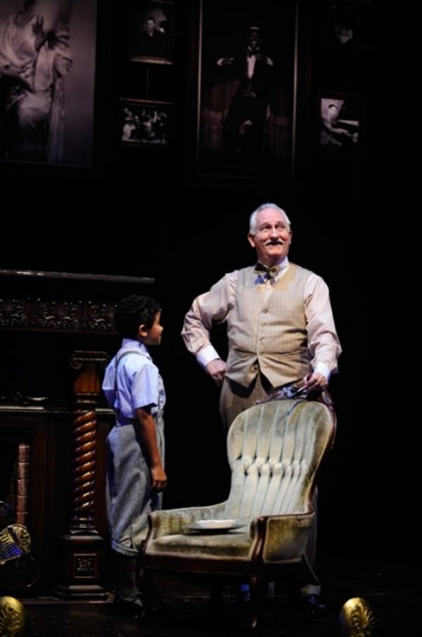 Twist (left, Alaman Diadhiou) speaks with Mr. Prudhomme (E. Wade Benson) Photo